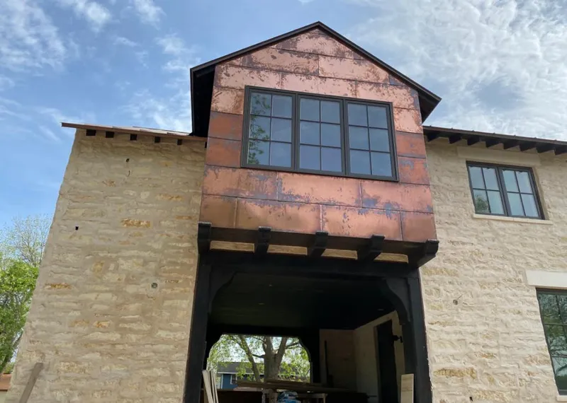 Copper metal panel facade on a stone building for Metal Roof Coating in Hernando